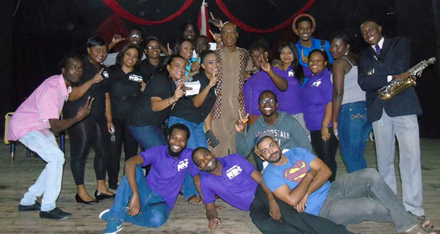 (Mr. Henry Rodney – surrounded by some of the performers and organizers at the All Star Benefit Concert)