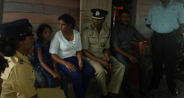 ‘B’ Division Commander Ian Amsterdam and ranks speak with relatives of the murder victims on Monday