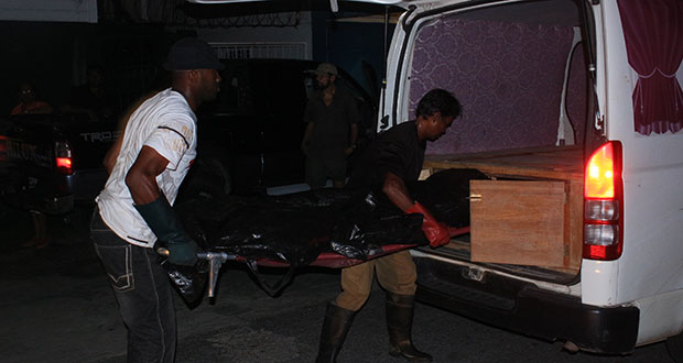 Undertakers placing Adams’ body in a hearse Wednesday evening. (Ravin Singh photos)