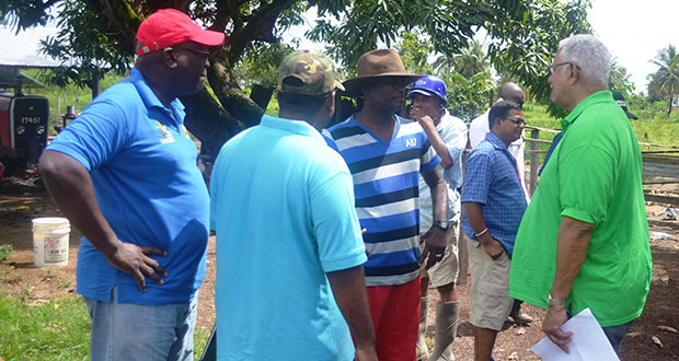 Agri.-Minister-Noel-Holder,-GLDA-CEO-Mr.-Nigel-Cumberbatch-while-engaging-farmers-during-the-outreach-web