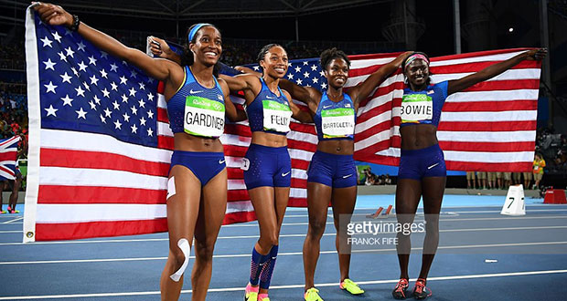 (FromL) USA's English Gardner, USA's Allyson Felix, USA's Tianna Bartoletta and USA's Tori Bowie celebrate after they won the Women's 4x100m Relay Final during the athletics event at the Rio 2016 Olympic Games at the Olympic Stadium in Rio de Janeiro last night. / AFP / FRANCK FIFE (Photo credit should read FRANCK FIFE/AFP/Getty Images)