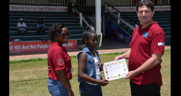 One of the children receives her certificate of participation