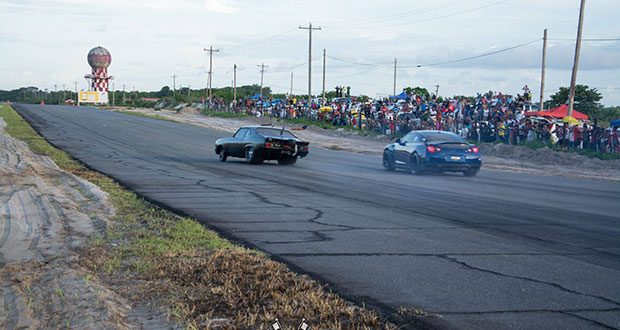 Azurdeen Mohammed’s Nissan GT-R (right) takes on Suriname’s Chevrolet Nova during an earlier round of Drags in Guyana. (Sean Charles photo)