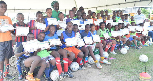 Students of the Tavel Foundation Youth Organisation August camp pose with their certificates.