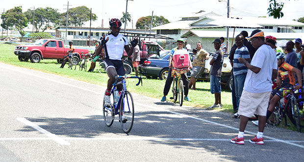 Team Evolution’s Orville Hinds crosses the finish line unchallenged to win the feature event of the FSCC’s Memorial Cycle Programme (Adrian Narine photo)