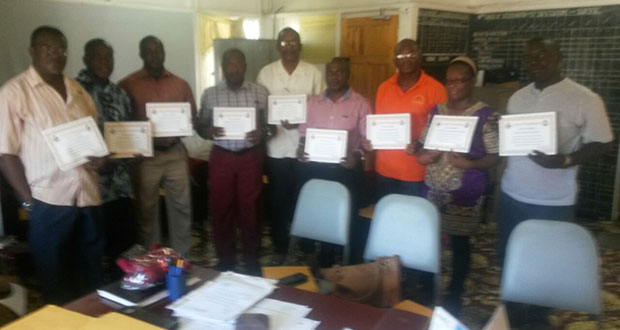 Nine of 12 religious leaders awarded by the police pose with their certificates of acknowledgement