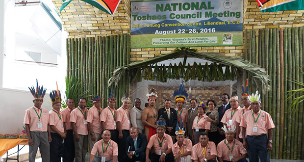 Several indigenous leaders pose with officials of the government prior to the opening of the NTC meeting on Monday.