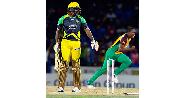 Wild celebrations erupt after Chris Gayle is bowled by Christopher Barnwell.
