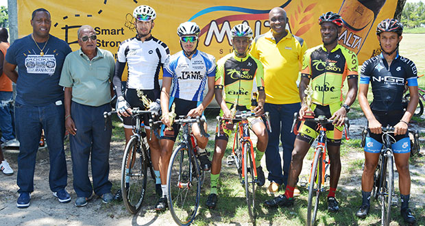 From left: Mortimer Stewart and  Hassan Mohamed pose with the respective winners in the National Park.