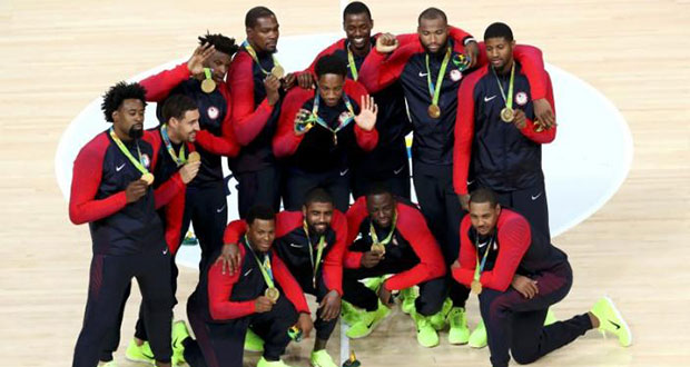 United States players pose with their gold medals during the presentation ceremony for men's basketball. REUTERS/Antonio Bronic