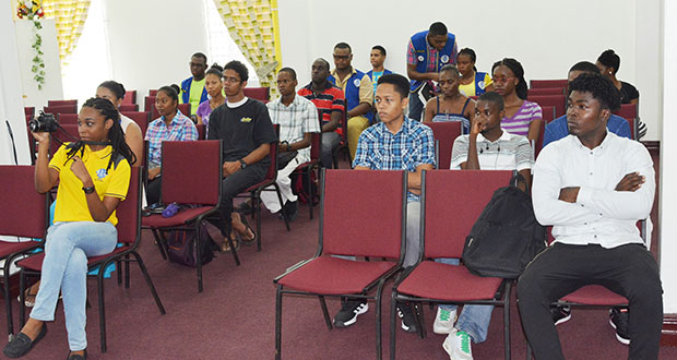 Youngsters listen attentively to presentations on parenting skills last Saturday at the National Library