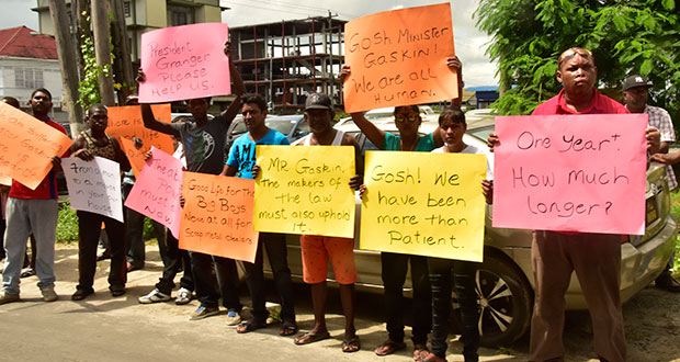 Members of the Guyana Scrap Metal Recyclers’ Association protesting outside the office of Minister of Business, Dominic Gaskin