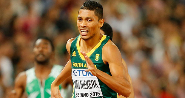 Wayde Van Niekerk of South Africa crosses the finish line to win gold in the Men's 400 m in world record time.
