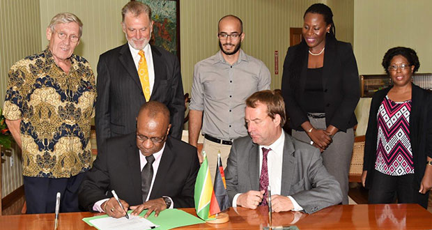 Minister of State, Mr. Joseph Harmon and Germany’s Regional Director for Latin America and the Caribbean, Ambassador Dieter Lamle signing the agreement. Looking on are, from left: Mr. Ben Ter Welle, Ambassador Lutz Hermann Gorgens, Commissioner of the Protected Areas Commission (PAC), Mr. Damian Fernandes, Ms. Ndibi Schwiers-Ceres and Deputy Commissioner at the PAC, Ms. Denise Fraser