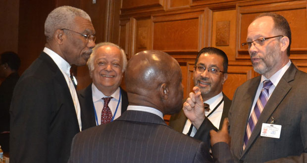 Foreign Affairs Minister Carl Greenidge makes a point to CARICOM Secretary-General Irwin LaRocque on Friday at  UN Headquarters in New York. Also in photo are President David Granger, Sir Shridath Ramphal and a representative of CARICOM.