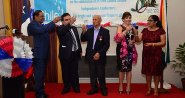 Prime Minister Moses Nagamootoo performing the duties of President, toasts with Chilean Ambassador to Guyana Claudio Rachel Rojas, Honorary Consul to Chile, Yesu Persaud along with the spouse of the Prime Minister, and the Ambassador