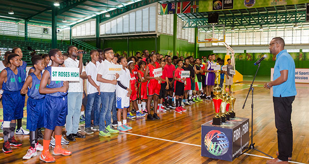 Director of Sport Christopher Jones addressing the teams at yesterday’s opening ceremony.  (Delano Williams photos)