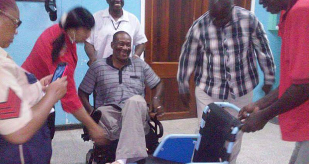 Happy in his new motorised wheelchair