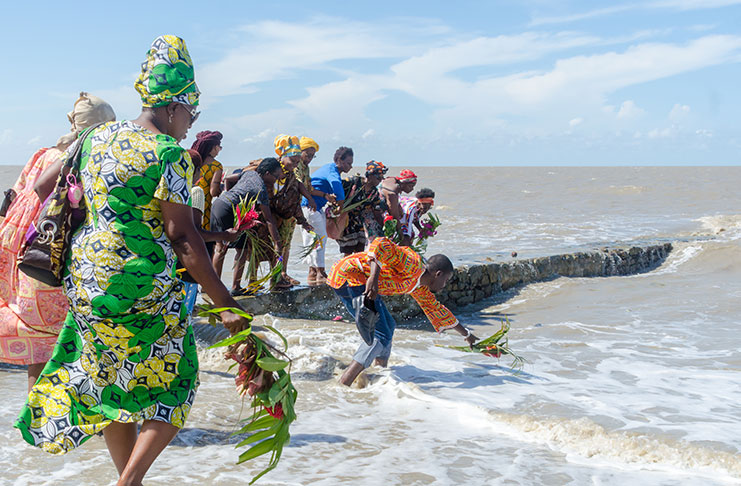 Afro-Guyanese pay floral tributes to their ancestors whose bones were scattered across the Atlantic Ocean during the Transatlantic Slave Trade