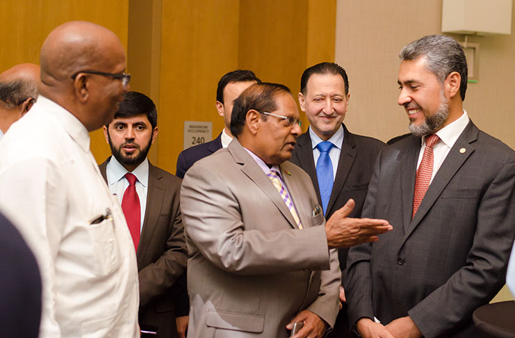 Prime Minister Moses Nagamootoo shares conversation with Mr Sayed Aqa, Vice President of the Islamic Development Bank at a reception at the Guyana Marriott Hotel Wednesday evening. Others in photo, from left are, Minister of Finance Winston Jordan and officials of the Bank, namely Mr Saifullah Abid, Anise Terai (partly hidden) and Mr Mohammed Jamal (Delano Williams photo)