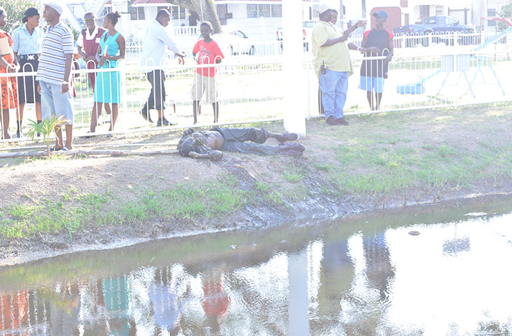 The unidentified body after it was fished out of the Church Street canal by the police on Thursday afternoon. [Daniel Haynes photo]