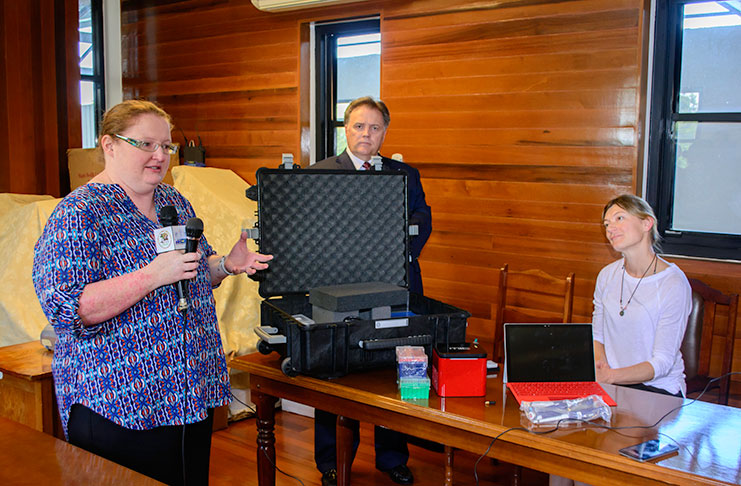 Developer of the zika testing equipment, Dr. Rebecca Garcia, speaks at the press conference while Chief Executive Officer (CEO) of Co-Diagnostics, Dwight Egan, and Molecular Scientist Dr. Jana Kent look on