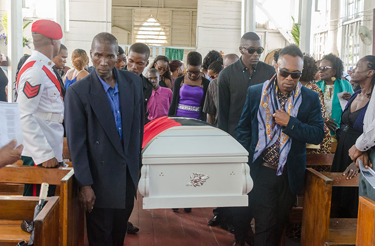 Sons of the late Malcolm Corrica, Malcolm Corrica Jnr and Jeffrey Corrica bear his casket at the St Matthew’s Anglican Church, Providence, East Bank Demerara, yesterday