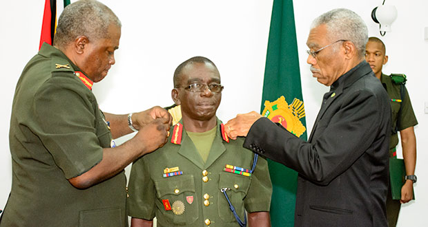 President David Granger and the outgoing Chief of Staff Brigadier Mark Phillips decorating the new Chief of Staff, Brigadier George Allan Lewis with his new badge of rank at Base Camp Ayanganna (Samuel Maughn photo)