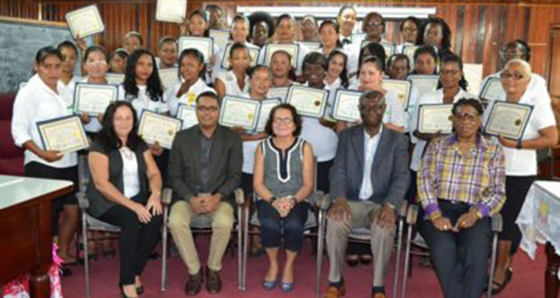 First Lady Sandra Ganger is flanked by, from left, facilitators of the Self-Reliance and Success in Business Workshop, Marcia Meredith and Yohann Sanjay Pooran; Regional Executive Officer Rupert Hopkinson, and Lieutenant Colonel (ret’d) Yvonne Smith in the front row. The latest batch of participants in the workshop are pictured standing (GINA photo)