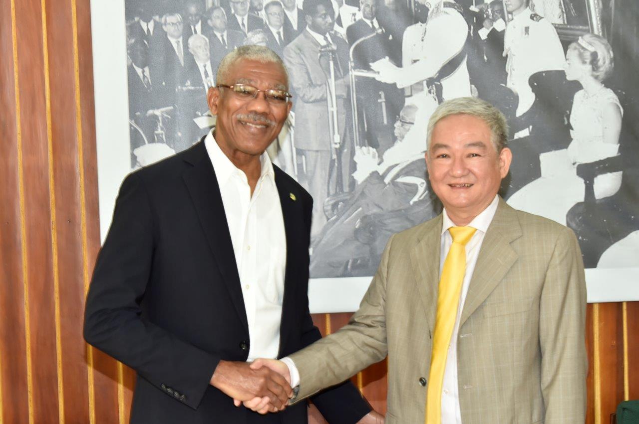 President David Granger and China's Ambassador to Guyana, Mr. Zhang Limin at the Ministry of the Presidency