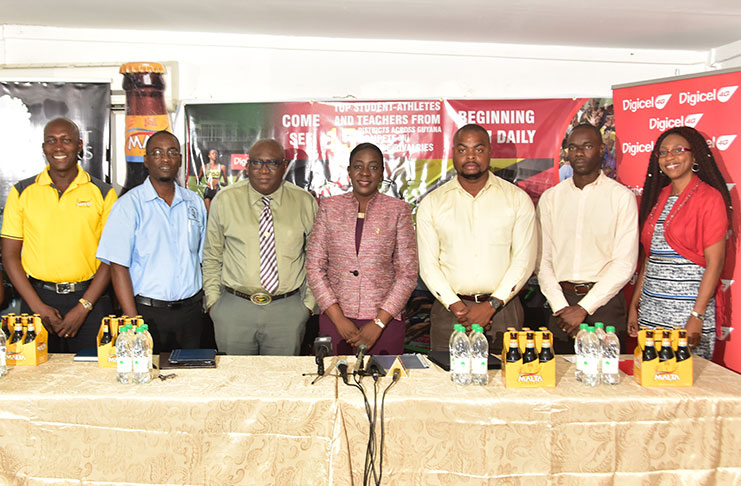 At the head table during yesterday’s launch, from left: Banks Malta Brand Manager, Clayton McKenzie, GTU President, Mark Lyte, Chief Education Officer, Marcel Hutson, Minister responsible for sports, Nicolette Henry, Marketing and PR Officer, Edison Jefford, Principal Assistant Secretary within the Ministry of Education, Glendon Fogenay, and Digicel’s Marketing Executive,Jacqueline James