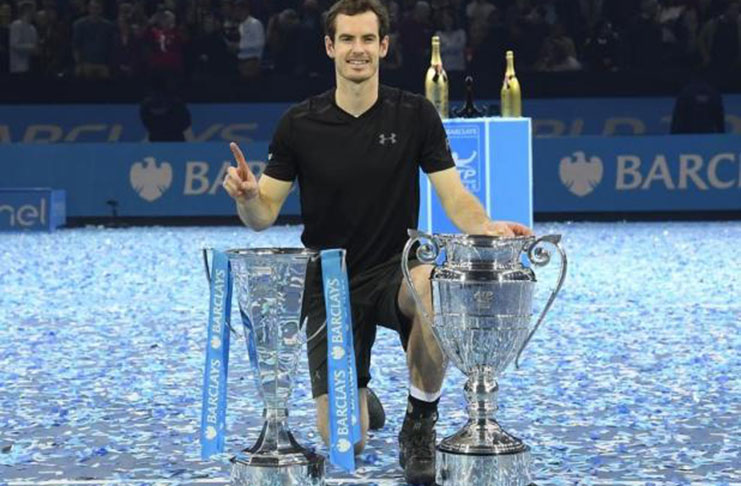 Great Britain's Andy Murray celebrates winning the final against Serbia's Novak Djokovic with the ATP World Tour Finals trophy and Year-End No. 1 Trophy Reuters / Toby Melville Livepic