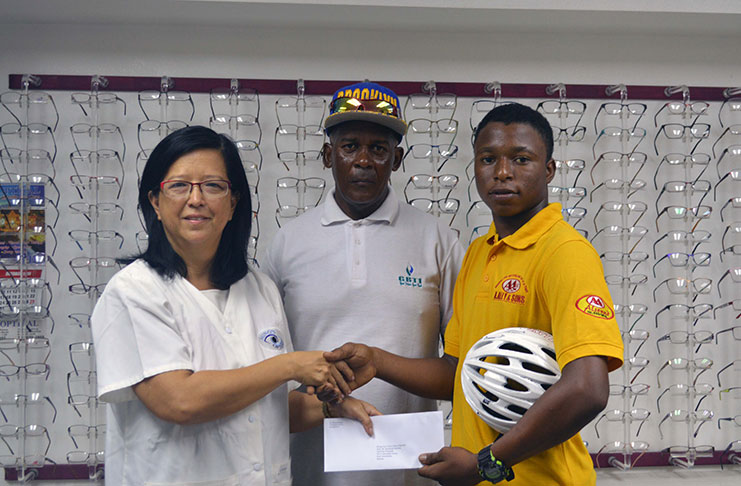 Left to right is Dr Michele Ming,Optometrist; Mr. Randolph Roberts, national coach and Zaman Khan,Juvenile National Champion