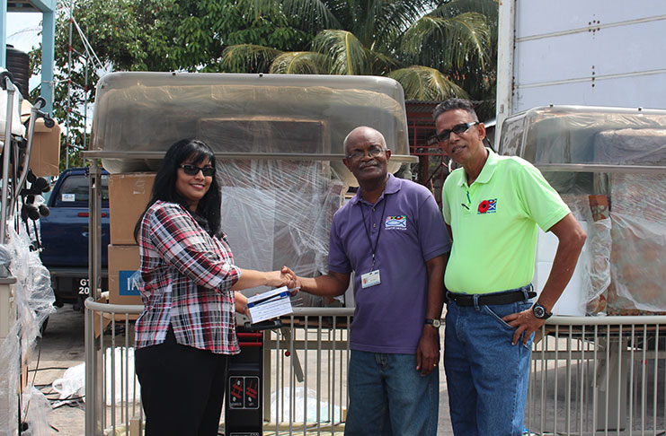 Dr Seepersaud with Food for the Poor (Guyana) Incorporated Public Relations Manager Wayne Hamilton and Field Officer Compton Giddings