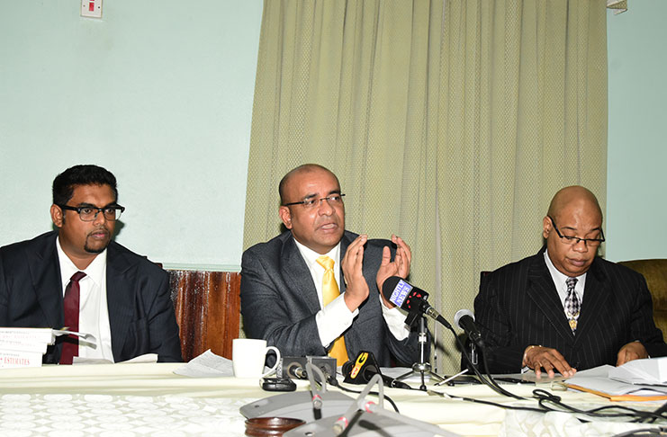 Opposition Leader, Bharrat Jagdeo (centre) flanked by and MPs, Irfaan Ali (left) and Bishop Juan Edghill (right) (Adrian Narine photo)
