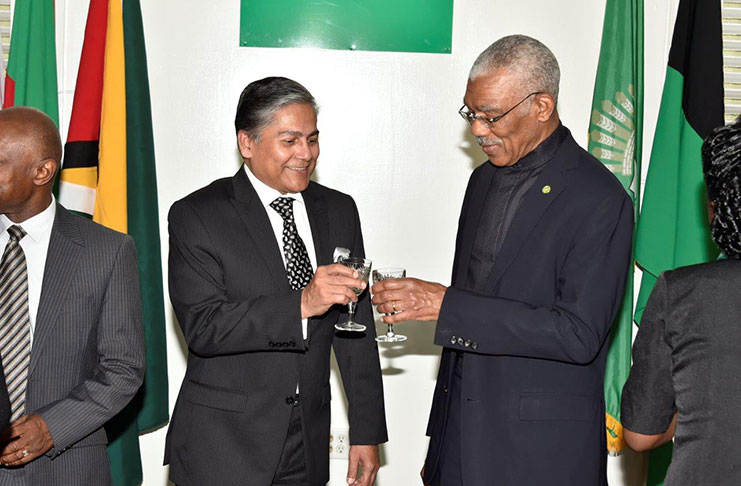 President David Granger toasts to strengthened relations  between Guyana and Bangladesh with High Commissioner Mohammad Ziauddin of the People's Republic of Bangladesh