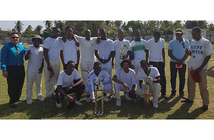 The victorious Buxton Under-19 team pose with ECCB president Bissoondyal Singh and Club president Esse Peters.