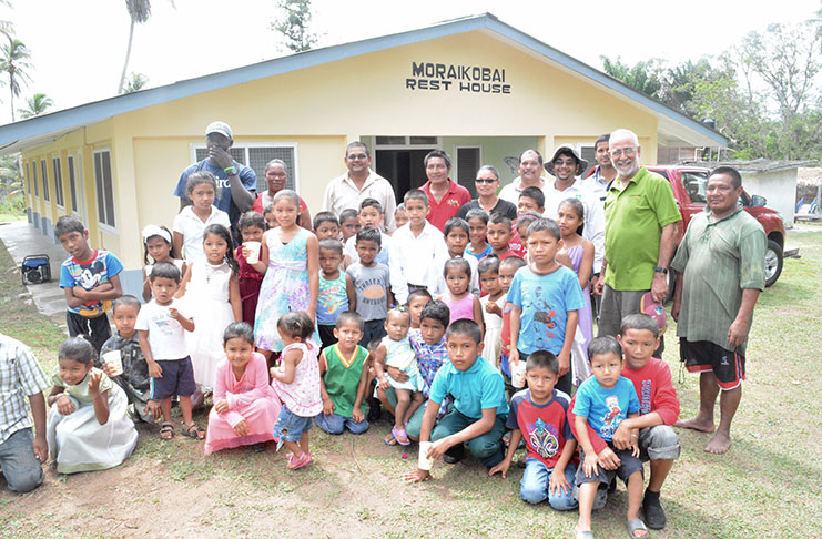 The GTA team sharing a moment with some of the villagers