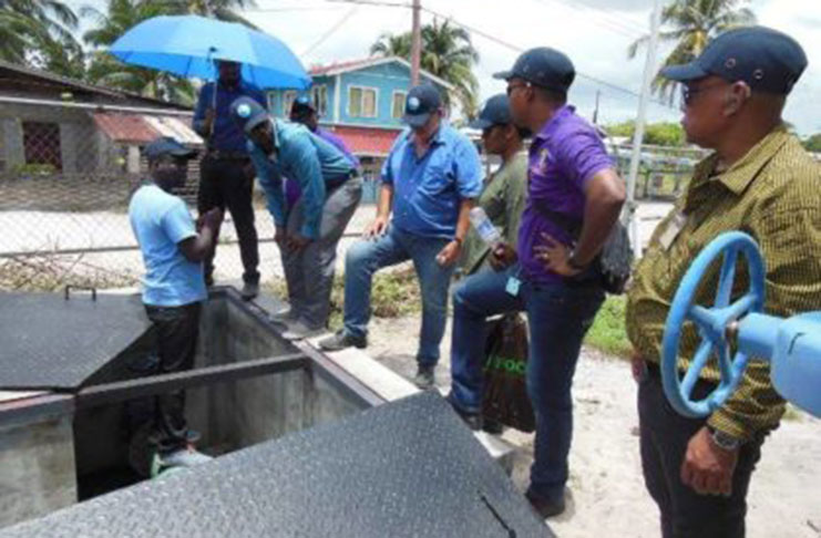 Officials from GWI & the Suriname Water Company during a visit to the Amelia’s Ward Water Treatment Facility