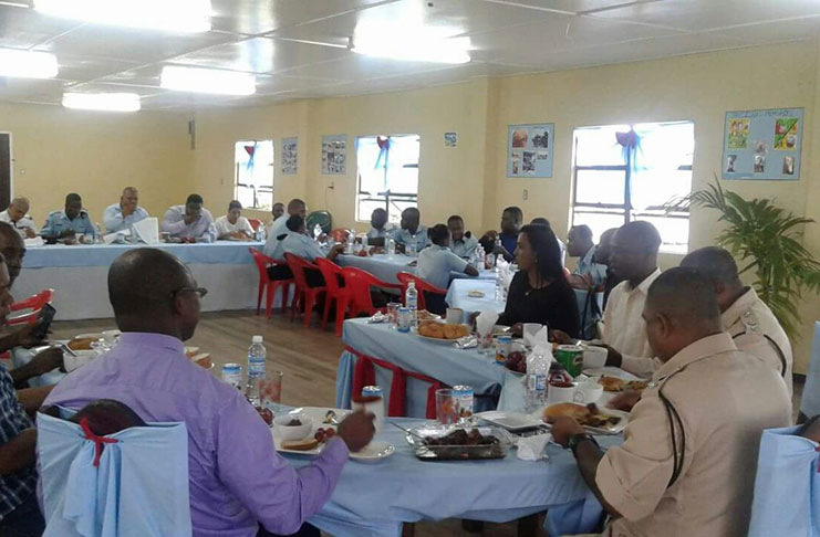 Commander Ravindradat Budhram (sitting at the head of the table) with some of the ranks at the Christmas breakfast at the Bartica Recreational Centre