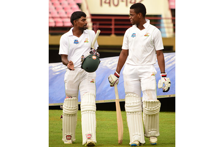 Guyanese openers Rajendra Chandrika and Shimron Hetmyer walk off the playing area after overhauling the victory target in just 2.4 overs. (Adrian Narine photos)