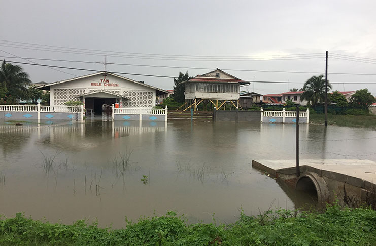 The road that leads to the Tain Bible Church was inundated on Friday