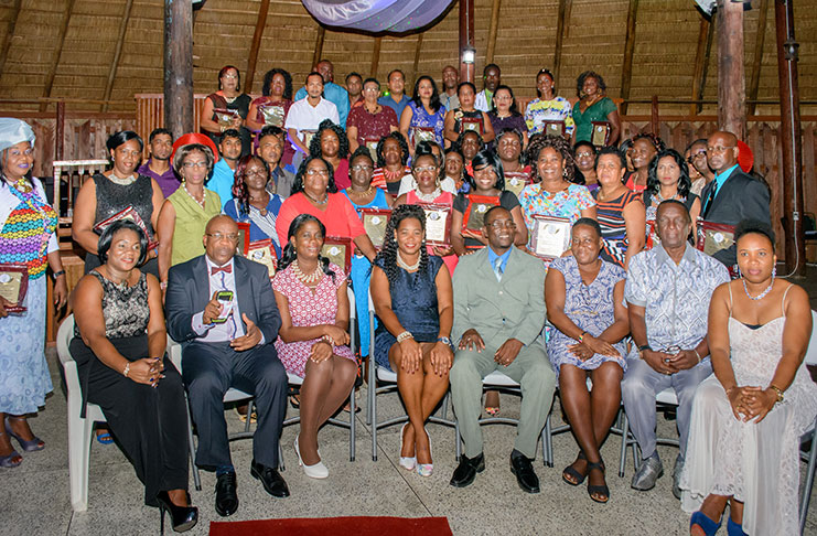 GTU General-Secretary, Coretta Mc Donald (left) and President, Mark Lyte (fourth from right) pose with the awardees and executives of the union after the awards ceremony at the Umana Yana last Tuesday.