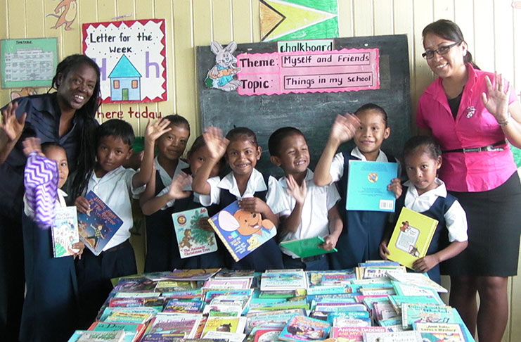 Aunt Lorraine (left) and Ms Renata Ifill with their young charges during a day out at Wakapao Primary recently