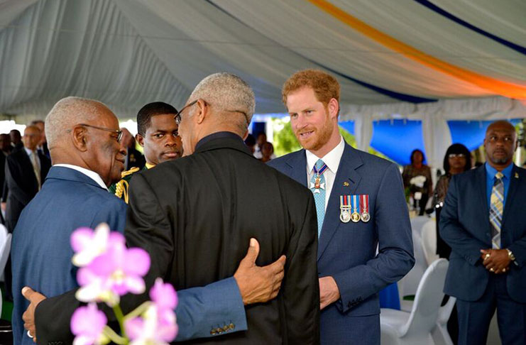 President David Granger (backing camera) seems to be enjoying a light moment with Prince Harry and another official at the Barbados 50th Anniversary dinner Wednesday evening in Bridgetown50