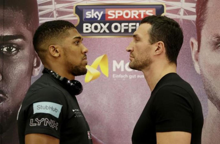 Anthony Joshua and Wladimir Klitschko pose after the press conference. (Action Images via Reuters/Henry Browne)