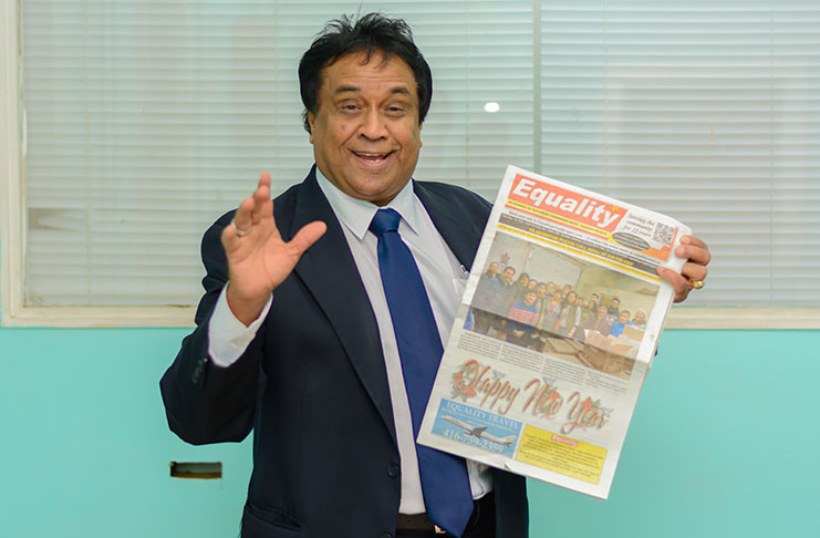 Mr. Bkaskar Sharma, Publisher and Editor-in-Chief of Equality News, displays a copy of his newspaper, Equality