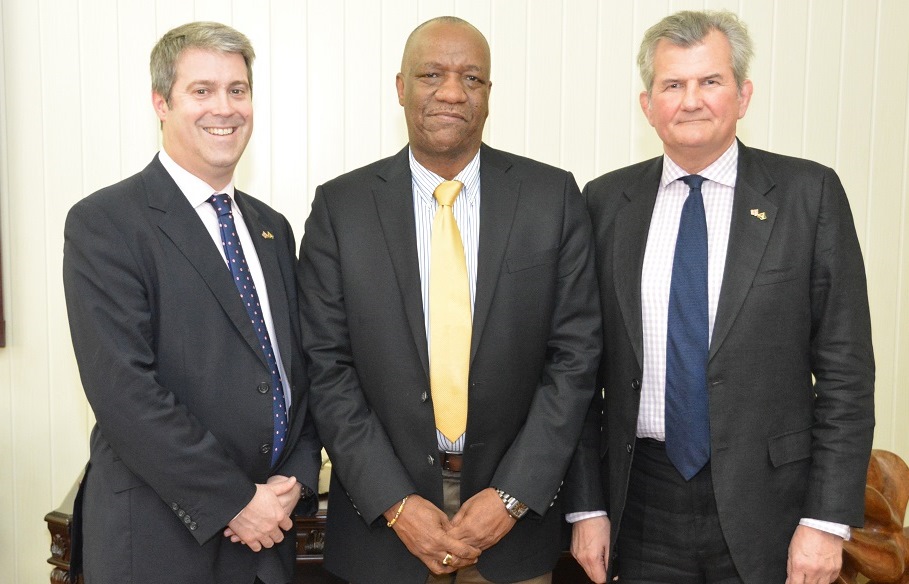 From left: Mr. Nick Forwood, Director- Strategic Defence and Security Management Services and Defence; Engineering, Design, Construction, Management (AECOM), Minister of State, Mr. Joseph Harmon and Mr. Russell Combe, Senior Security Sector Reform Advisor.