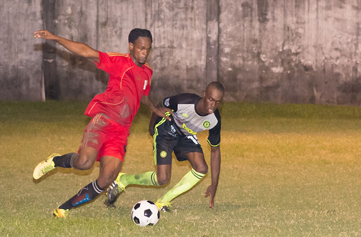 Part of the action last Monday night when Police drew with Mahaica Determinators 2-2 at the GFC ground. (Delano Williams photo)