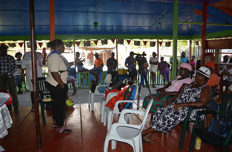 Minister Simona Broomes advocating to miners at Kurupung to form a syndicate
